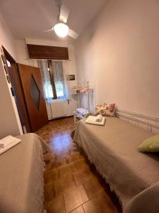 A bed or beds in a room at Little house Lezzeno