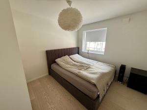 Ένα ή περισσότερα κρεβάτια σε δωμάτιο στο Bjerkakervegen Retreat