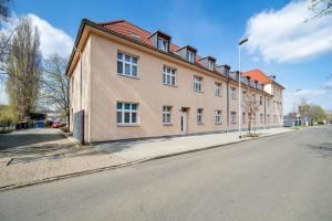 a large building on the side of a street at Larooms - Nula#3 in Merseburg