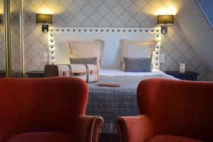 Le Trophée Boutique Hôtel Spa- La Loggia Appart'hôtel的休息区