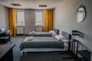 Postel nebo postele na pokoji v ubytování Hotel Świt