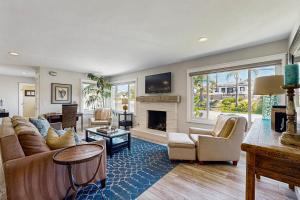 a living room with a couch and a fireplace at Ola Vista in San Clemente