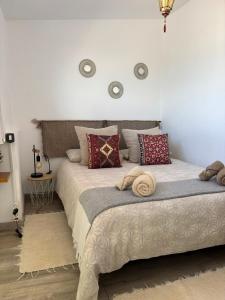 a bedroom with a large bed with pillows on it at Little Paradise in El Médano in Granadilla de Abona
