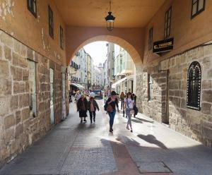 a group of people walking down a street at B&H Hotel Boreal Viento Norte in Burgos
