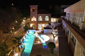 an overhead view of a swimming pool at night at Hotel Balneario de Lanjarón in Lanjarón