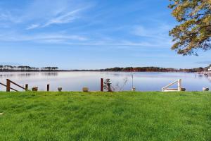 a view of a body of water with a grass field at Salt Pond - 15 Schooner Vill in Bethany Beach