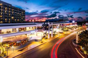 a city street at night with a building at Sonesta Maho Beach All Inclusive Resort Casino & Spa in Maho Reef