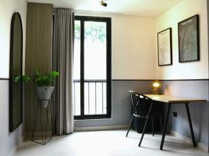 a dining room with a table and a window at Apt in el Poblado, walkable area with parking 215 in Medellín +7 photos