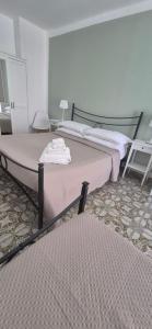 a bedroom with two beds in a room at Finestra sul porto in Marina di Camerota