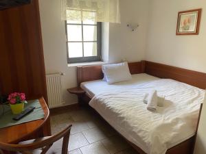 Postel nebo postele na pokoji v ubytování Penzion Janata
