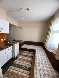 Ένα ή περισσότερα κρεβάτια σε δωμάτιο στο Özmert otel