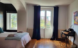Postel nebo postele na pokoji v ubytování Le Clos Ayanna