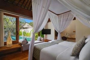 a bedroom with a bed and a window at Amarterra Villas Resort Bali Nusa Dua, Autograph Collection in Nusa Dua +43 photos