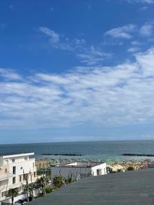 a view of the ocean from a building at Alcione113 Apartment in Francavilla al Mare