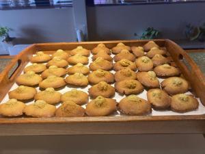 a tray of muffins sitting on a table at Hôtel Le Boïate in Arès