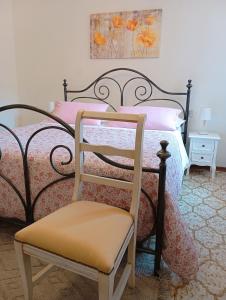 A bed or beds in a room at Affittacamere Chiti Melania