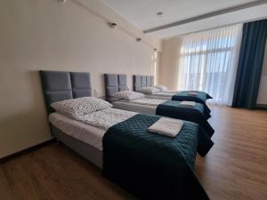 Postel nebo postele na pokoji v ubytování Figaro Apartaments