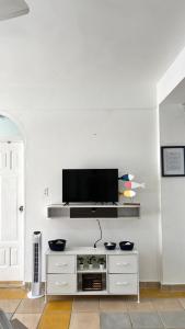 TV a/nebo společenská místnost v ubytování Dominicus Castillo Paradise