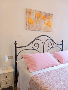 A bed or beds in a room at Affittacamere Chiti Melania