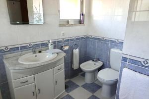 a bathroom with a sink and a toilet at Aylevarroo Penthouse in Caniço +41 photos