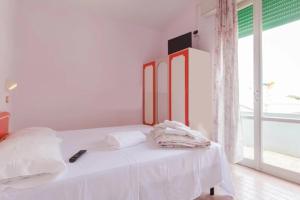 Postel nebo postele na pokoji v ubytování HOTEL Donati