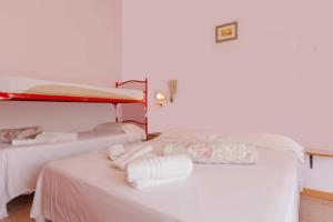 Postel nebo postele na pokoji v ubytování HOTEL Donati