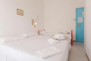 Postel nebo postele na pokoji v ubytování HOTEL Donati