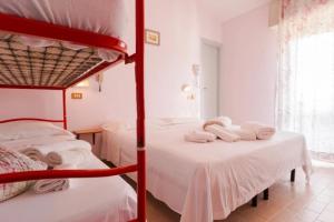 Postel nebo postele na pokoji v ubytování HOTEL Donati