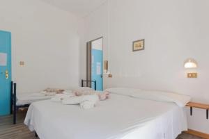 Postel nebo postele na pokoji v ubytování HOTEL Donati