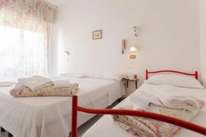 Postel nebo postele na pokoji v ubytování HOTEL Donati