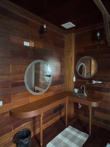 a bathroom with two mirrors and a sink at Solstice Phuket in Nai Thon Beach +184 photos