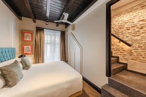Postel nebo postele na pokoji v ubytování Casa 1862 Heritage Suites by Stay Unique + 119 fotografií