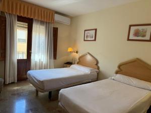 Postel nebo postele na pokoji v ubytování Hotel el Sol