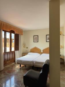 Postel nebo postele na pokoji v ubytování Hotel el Sol