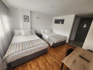 Postel nebo postele na pokoji v ubytování Hotel San Francisco + 45 fotografií