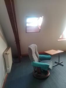 Posezení v ubytování M2Couronne + 4 fotografie