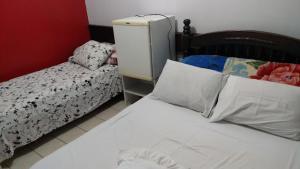 Postel nebo postele na pokoji v ubytování Pousada Express JK + 7 fotografií