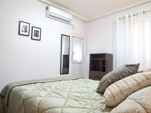 A bed or beds in a room at Gran piso pleno centro. Plaza del Pilar + Desayuno