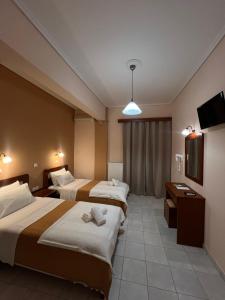 Postel nebo postele na pokoji v ubytování Hotel Nevada Kalamata