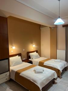 Postel nebo postele na pokoji v ubytování Hotel Nevada Kalamata