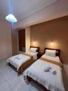 Postel nebo postele na pokoji v ubytování Hotel Nevada Kalamata