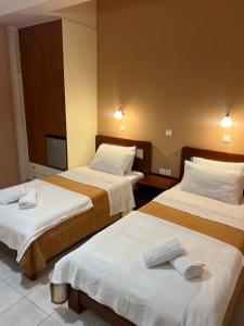 Postel nebo postele na pokoji v ubytování Hotel Nevada Kalamata