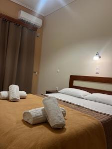 Postel nebo postele na pokoji v ubytování Hotel Nevada Kalamata