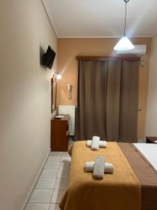 Postel nebo postele na pokoji v ubytování Hotel Nevada Kalamata