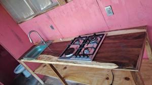 a kitchen counter with a stove and a sink at Bokanito Sam Chak in Boca del cielo