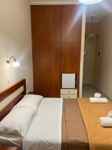 Postel nebo postele na pokoji v ubytování Hotel Nevada Kalamata