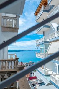 a view of the ocean from a balcony of a building at Arline's Luxury Retreat House in Sarandë