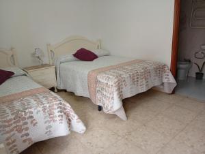 Posteľ alebo postele v izbe v ubytovaní JARDIN, TERRAZA Y BARBACOA