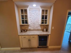 a kitchen with white cabinets and a counter top at Surf Club I, 1405 Condo in Palm Coast
