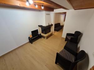 an empty living room with chairs and a fireplace at La Corte del Castello - Aeroporto delle Marche - Ancona in Falconara Marittima